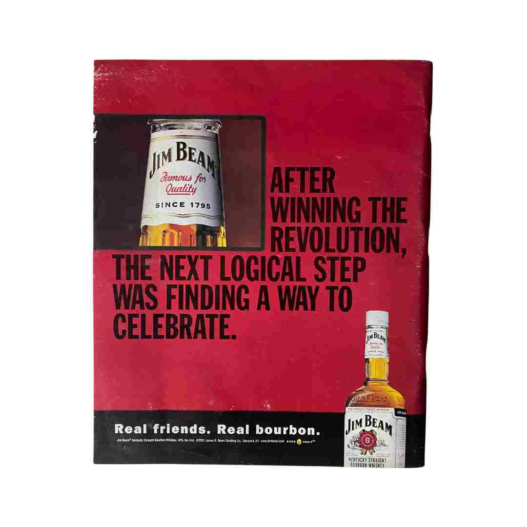 Vintage advertisement for Jim Beam bourbon highlighting a celebration theme, featuring the tagline 'After winning the revolution, the next logical step was finding a way to celebrate.' This image is part of the Rolling Stone Magazine July 5, 2001 Issue 872 featuring Angelina Jolie on the cover.