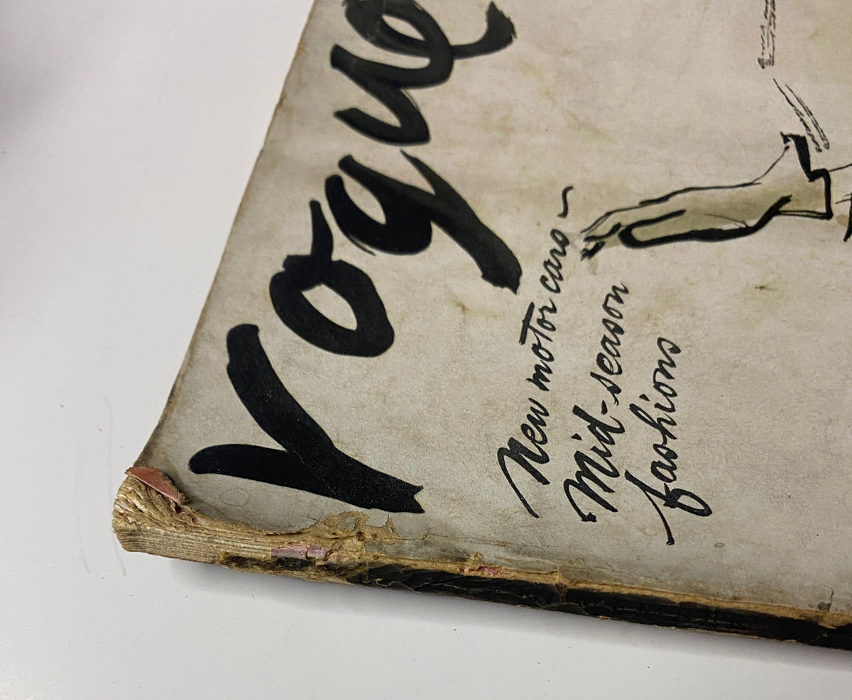 Vogue Magazine November 15, 1938 showcasing cover design with bold lettering and reference to new motor cars and mid-season fashions. Close-up view of magazine spine.