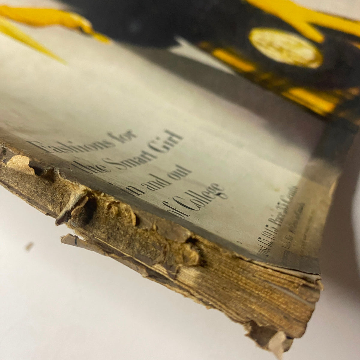 Detailed view of the bottom corner of Vogue Magazine August 15, 1945 revealing aged paper and wear, emphasizing its collectible vintage condition.
