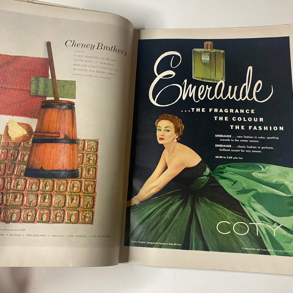 Coty fragrance advertisement from Vogue Magazine, November 1, 1952, featuring a glamorous woman wearing a green dress.