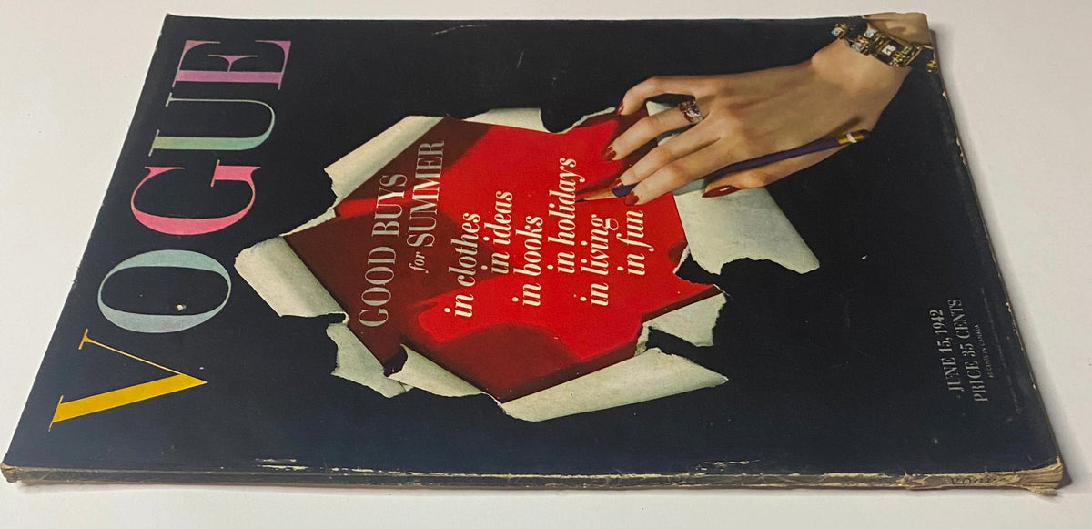 Close-up of the cover of Vogue Magazine June 15, 1942, emphasizing the title 'Good Buys for Summer' with visible wear, highlighting its vintage appeal.