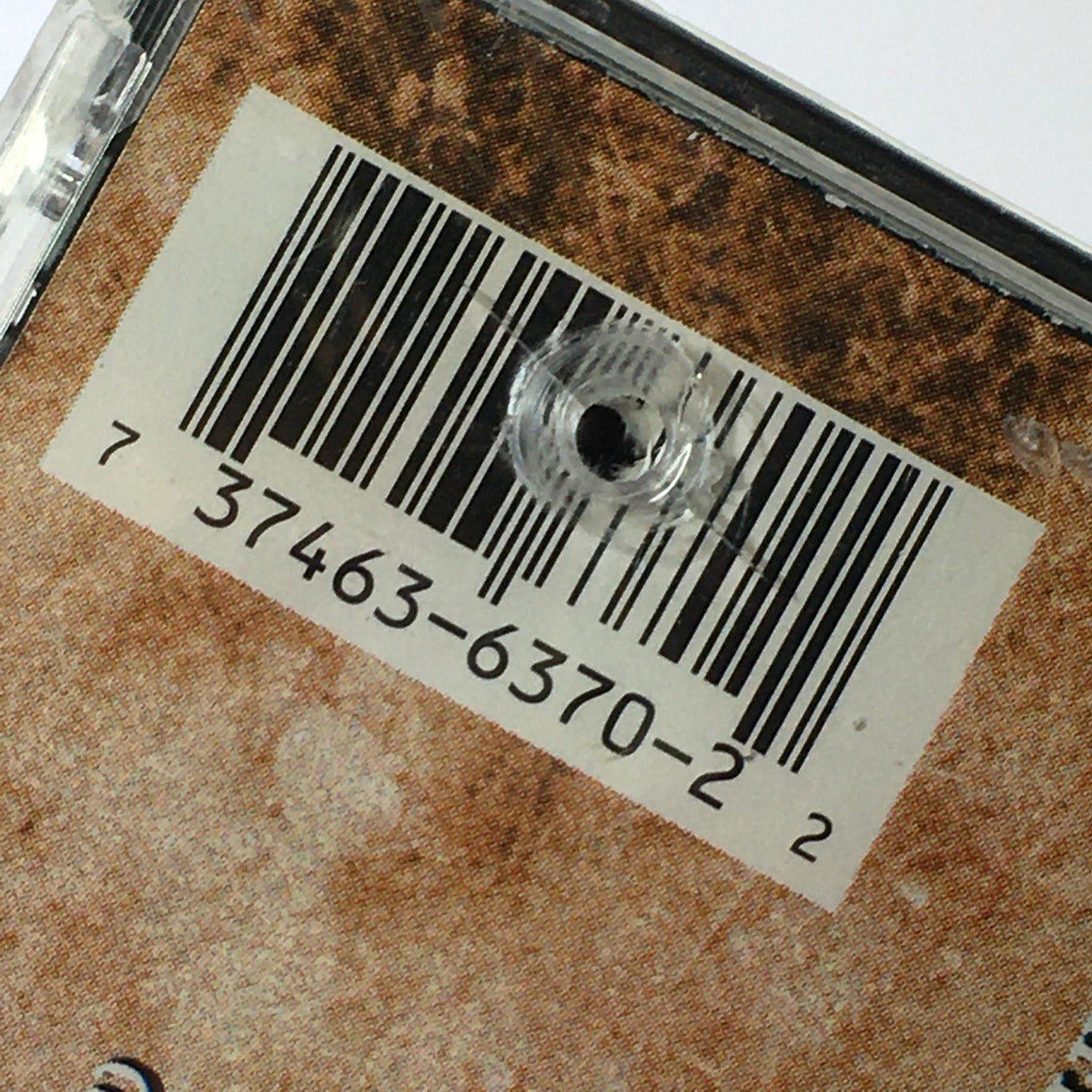 Barcode detail of Black Reign by Queen Latifah Music Audio CD, showing the cut-out mark on the barcode.