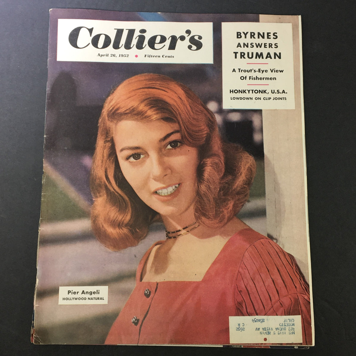 Cover of VTG Collier's Magazine dated April 26, 1952, featuring a young woman with wavy hair and vibrant attire, along with the headline "Byrnes Answers Truman."