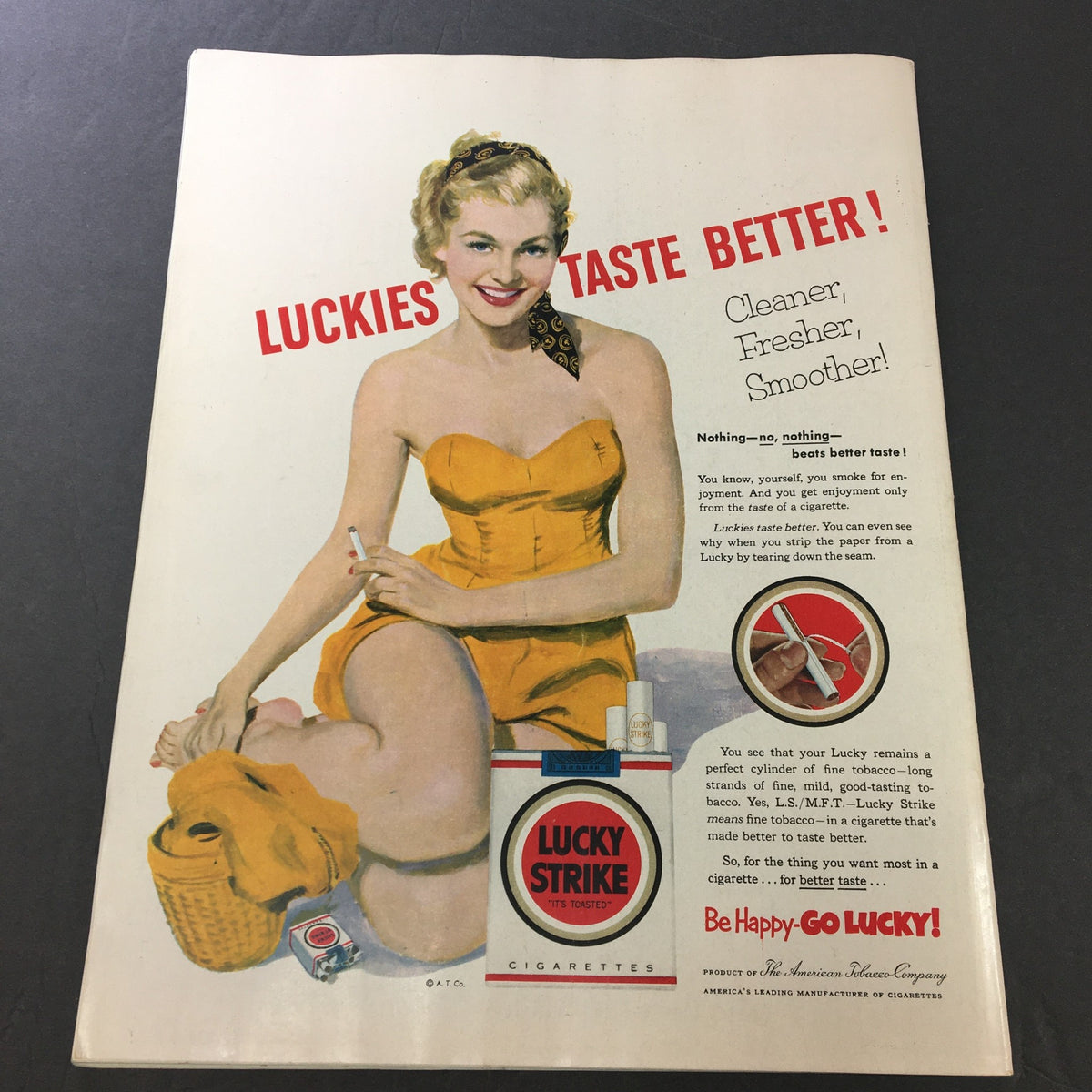 Vintage advertisement from VTG Collier's Magazine July 25, 1953 featuring a smiling woman in a yellow swimsuit promoting Lucky Strike cigarettes, highlighting the slogan 'Luckies Taste Better!'.