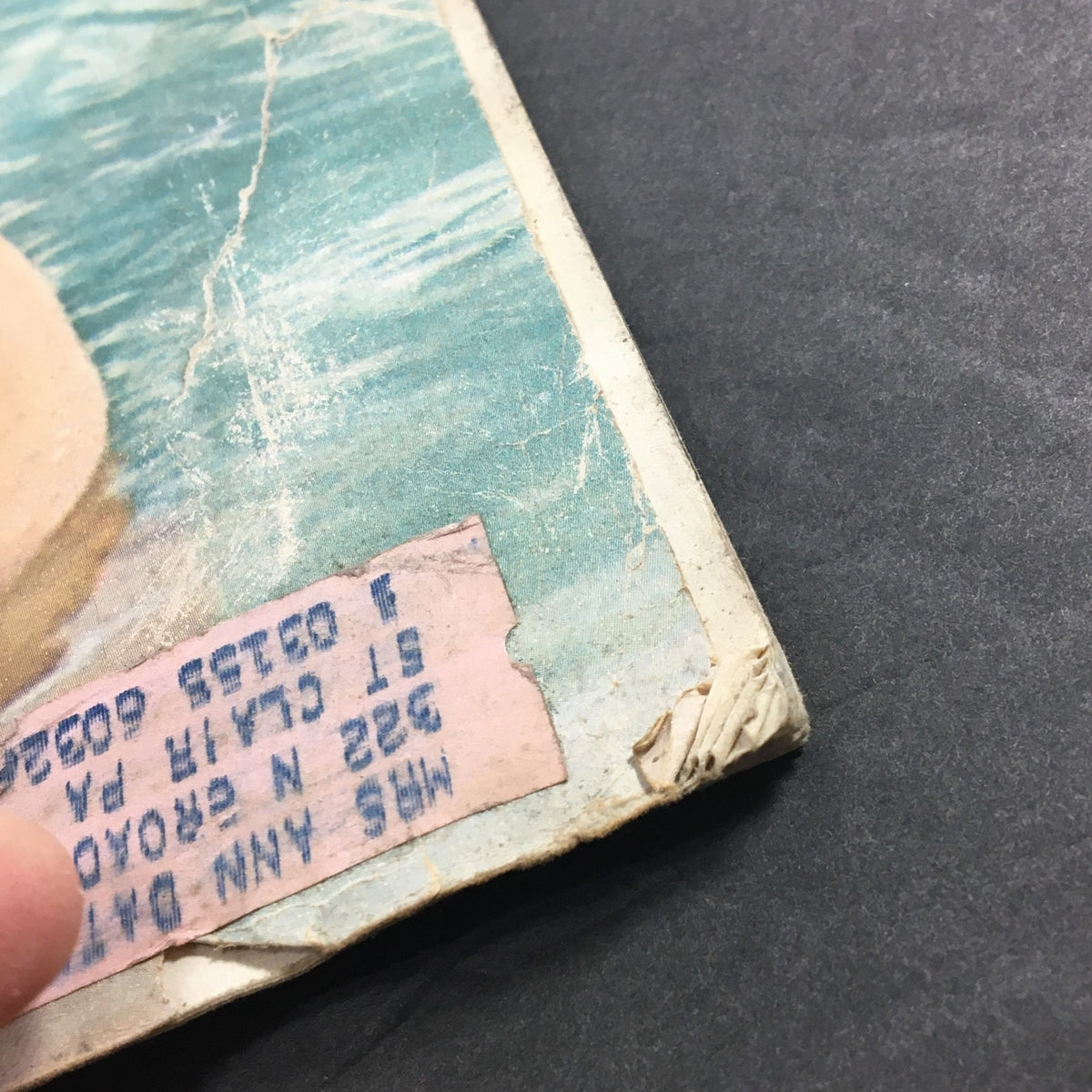 Detail of the edge of Collier's Magazine from June 24, 1955, showing signs of wear and an address label, emphasizing its collectible nature.