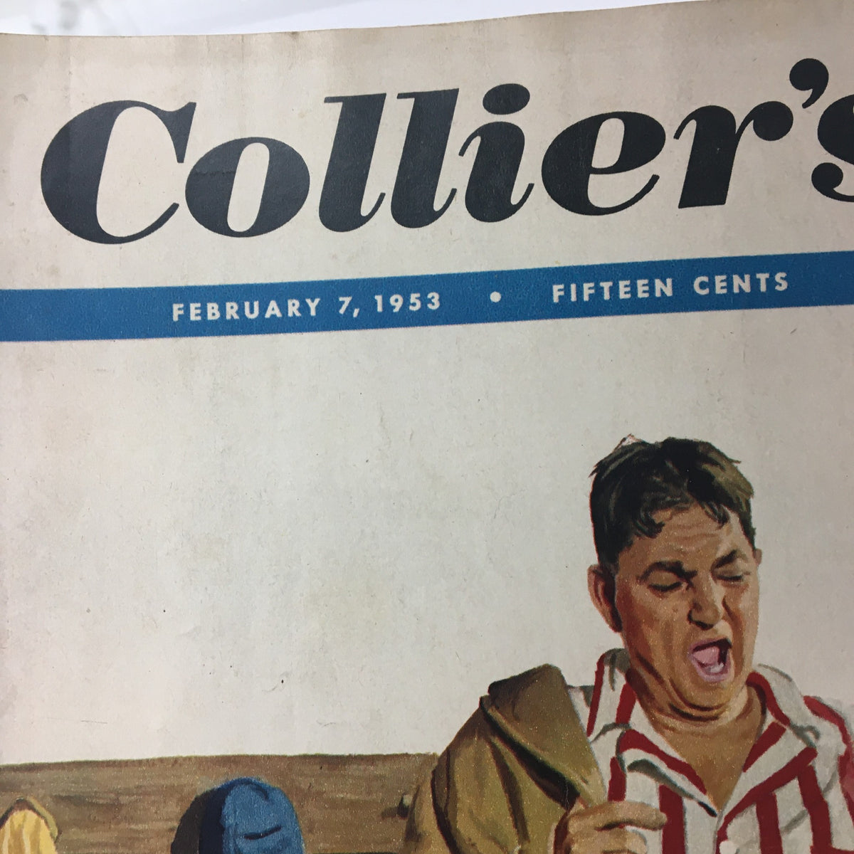 Close-up of the cover of VTG Collier's Magazine February 7, 1953 highlighting the date and magazine title, with an image of a man in a striped outfit.