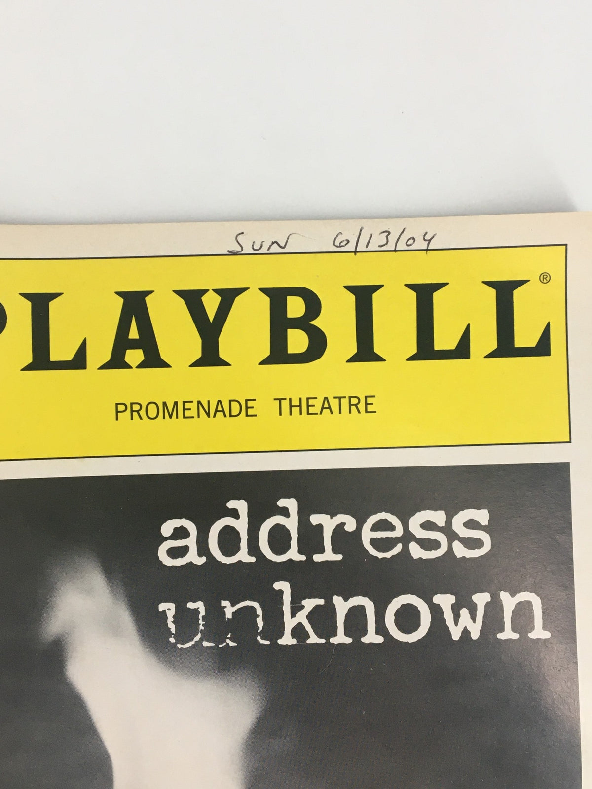 Close-up view of the 2004 Playbill for Address Unknown at The Promenade Theatre, featuring the title and date 'SUN 6/13/04' on the cover.