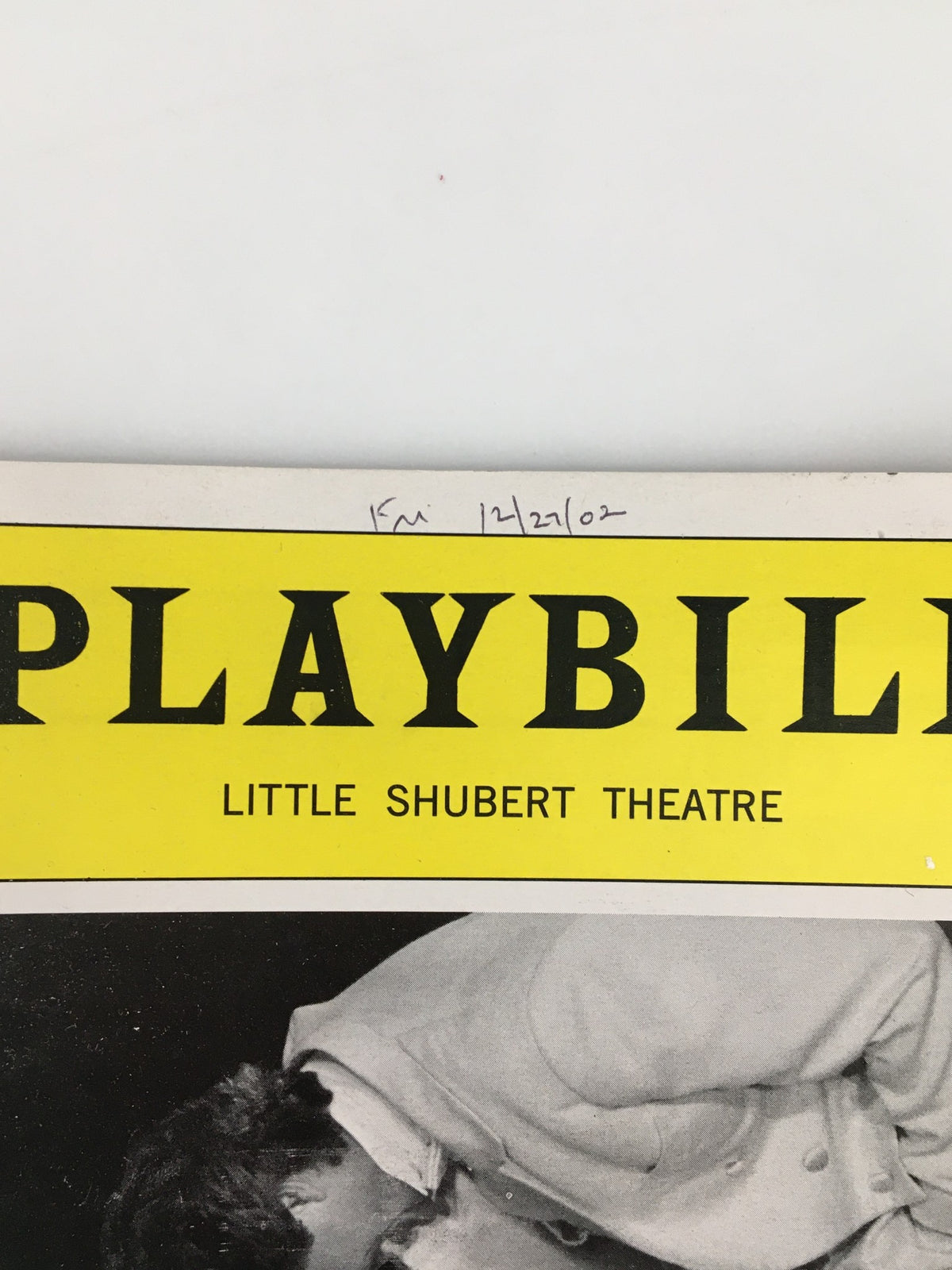 Close-up view of the 2002 Playbill from the Little Shubert Theatre with a date notation, highlighting Tommy Tune in White Tie and Tails.