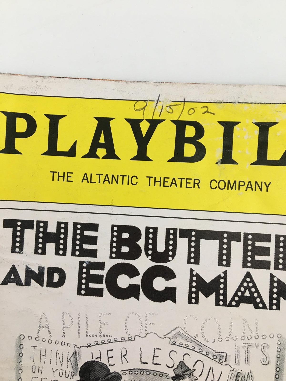 Close-up view of the 2002 Playbill for The Butter and Egg Man at the Atlantic Theater Company, highlighting the title and date of the performance, September 15, 2002.