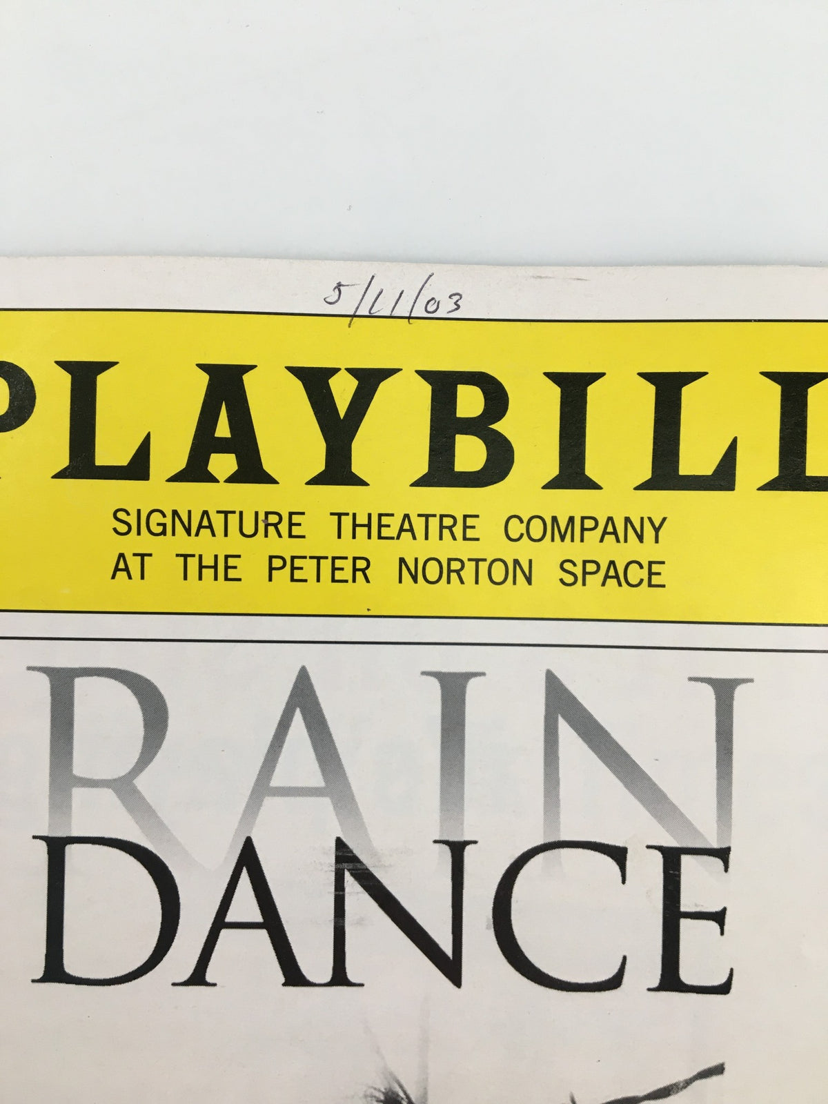 Close-up of the header from the 2003 Playbill for The Peter Norton Space Rain Dance by Lanford Wilson, featuring the signature theater company logo and production date.