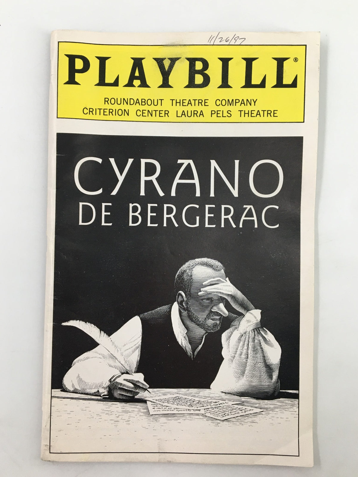 1997 Playbill for Cyrano De Bergerac featuring Frank Langella at the Laura Pels Theatre, showcasing a black and white image of Langella in character with a quill pen.
