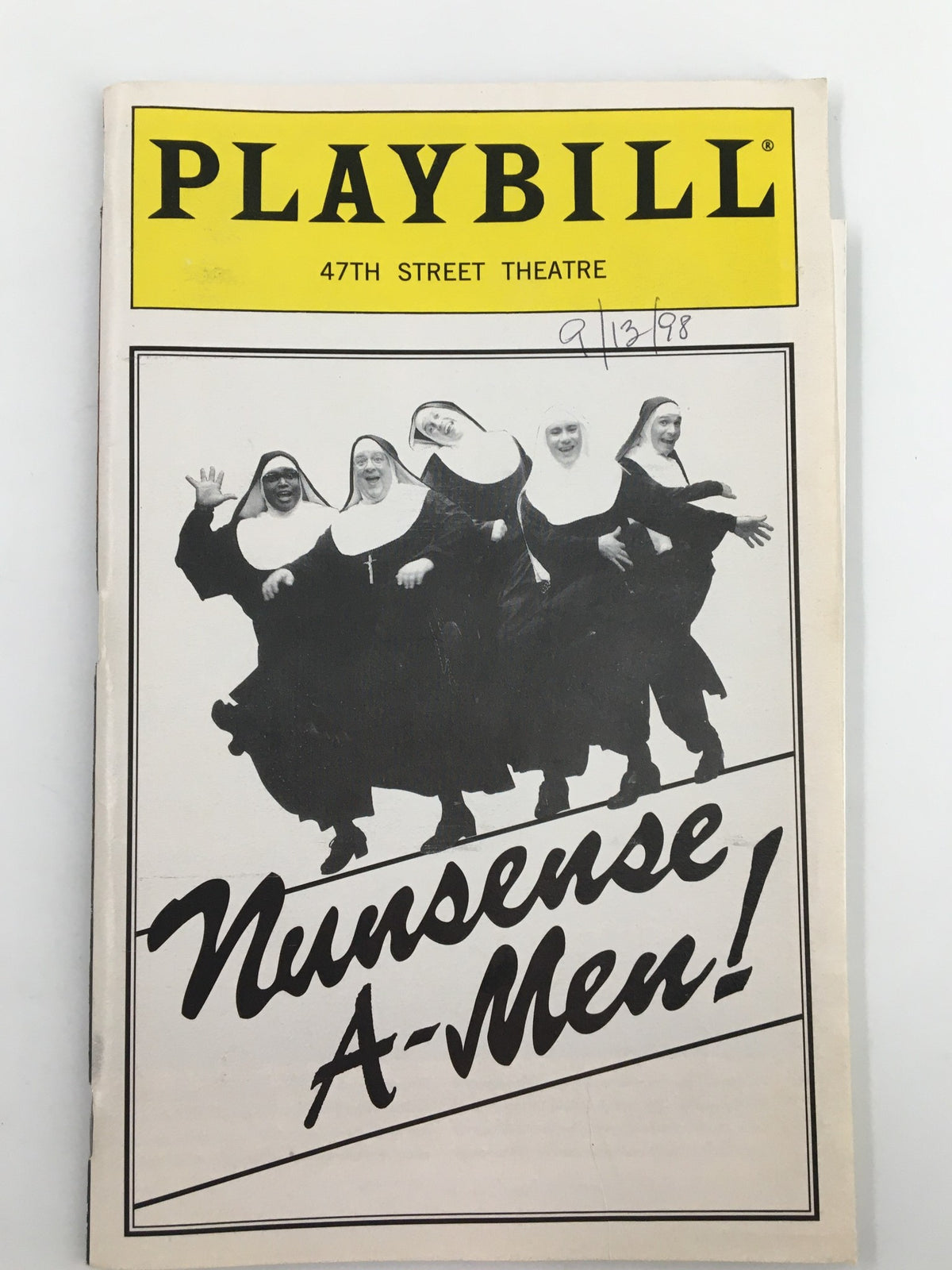 1998 Playbill from the 47th Street Theatre featuring the cast of Nunsense A-Men! with nuns performing dance choreography.