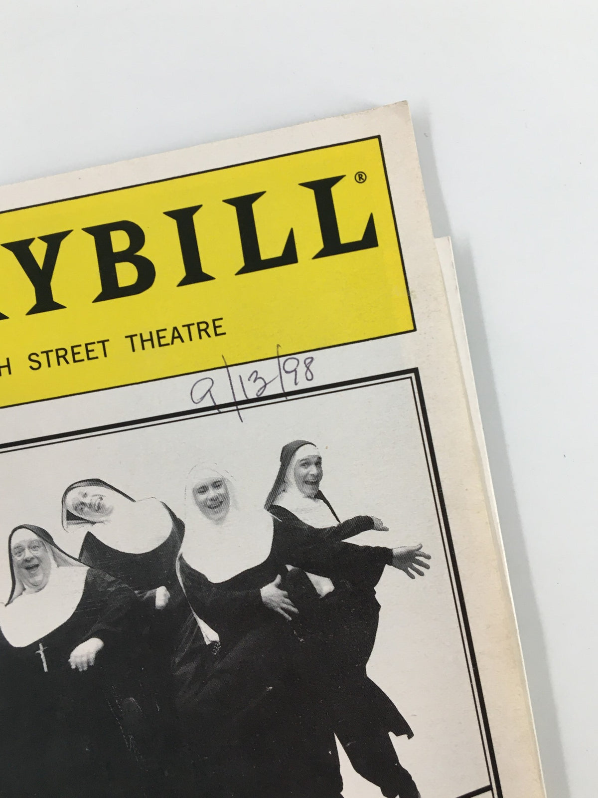 Close-up of the 1998 Playbill from the 47th Street Theatre for Nunsense A-Men!, showing the date and playful image of the nuns.
