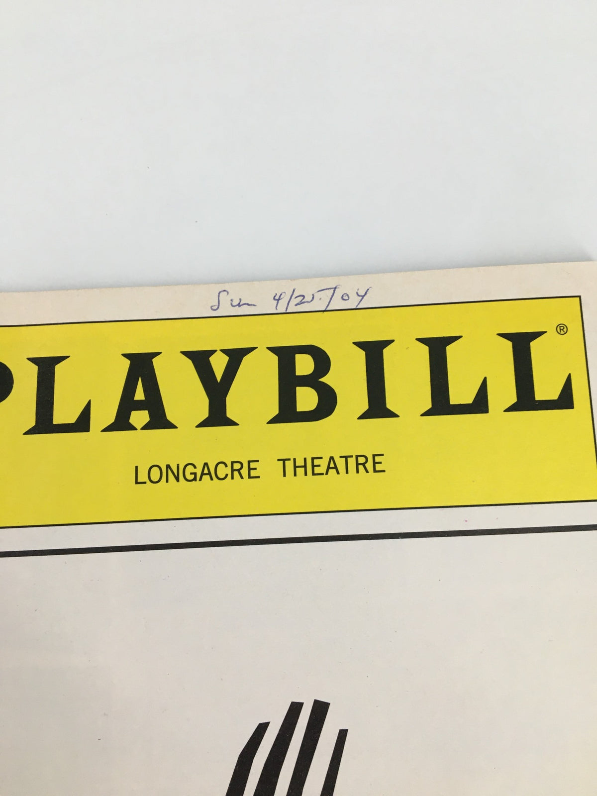 Close-up of the top section of the 2004 Playbill from Longacre Theatre for Prymate, highlighting the bold title and handwritten date.