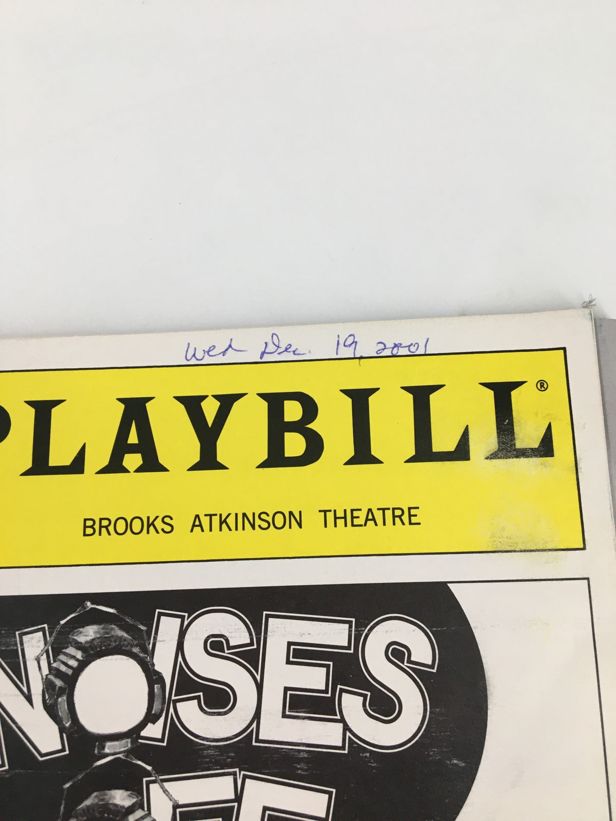 Date inscription on the 2001 Playbill for Noises Off at Brooks Atkinson Theatre, showing 'Wed Dec. 19, 2001' handwritten.