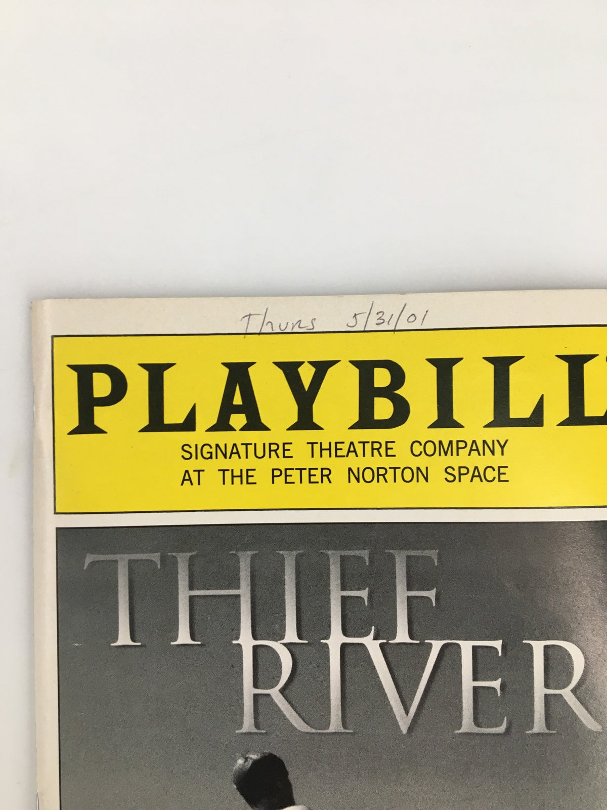 2001 Playbill for the Signature Theatre Company production of Thief River with Jeffrey Carlson, featuring a bright yellow header and program details.