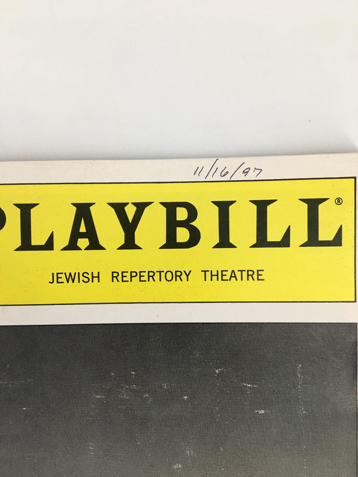 Close-up of the 1997 Playbill header for The Adjustment, highlighting the Jewish Repertory Theatre title.