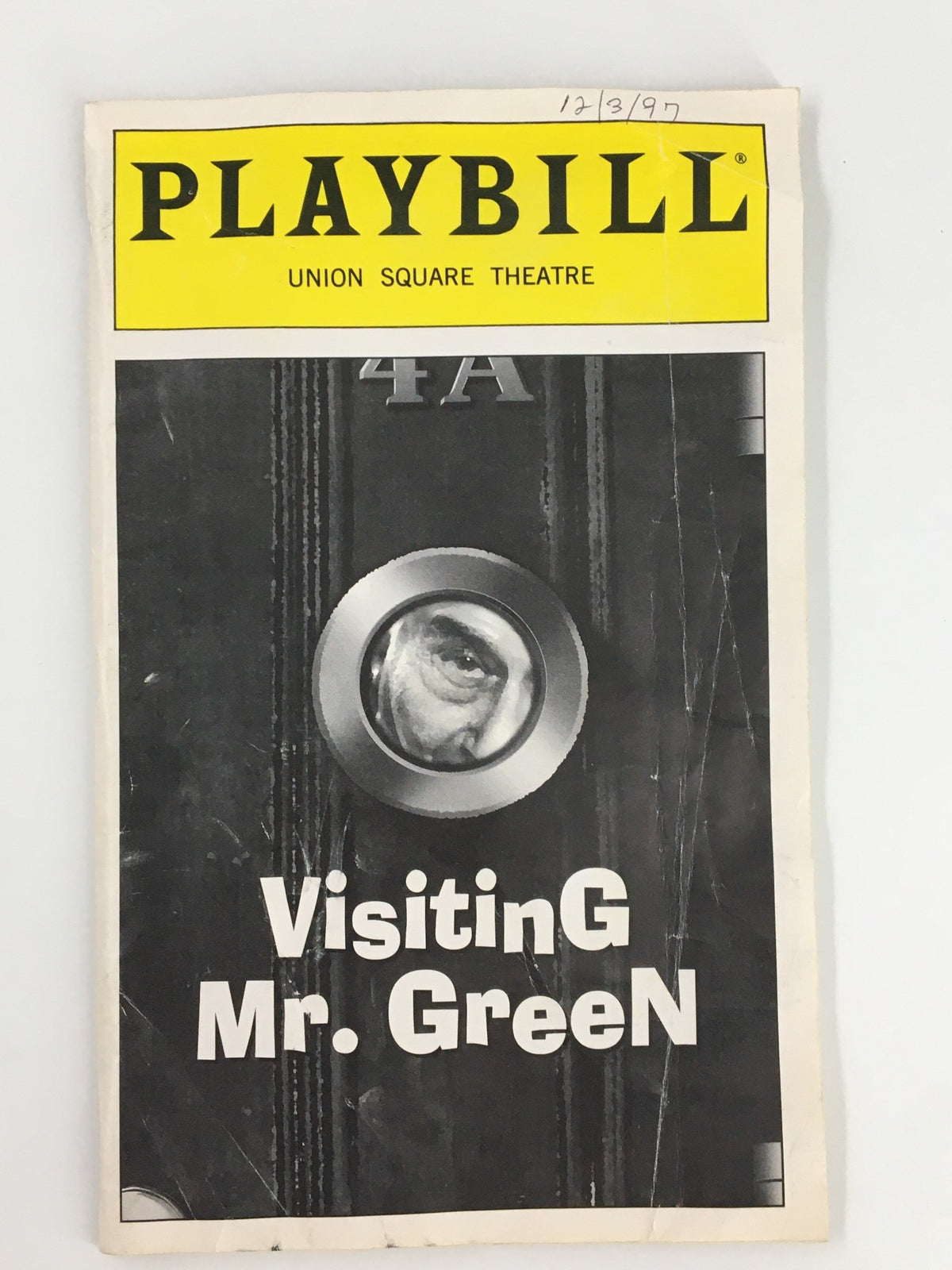 1997 Playbill for Visiting Mr. Green featuring Eli Wallach, showcasing a close-up of the cover with a unique design and theatrical details.