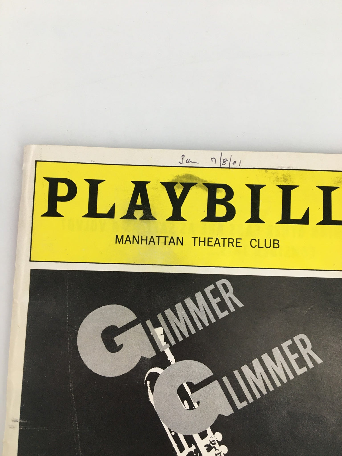 Close-up of the 2001 Playbill for Glimmer, Glimmer and Shine from the Manhattan Theatre Club, highlighting the title and vintage design elements.