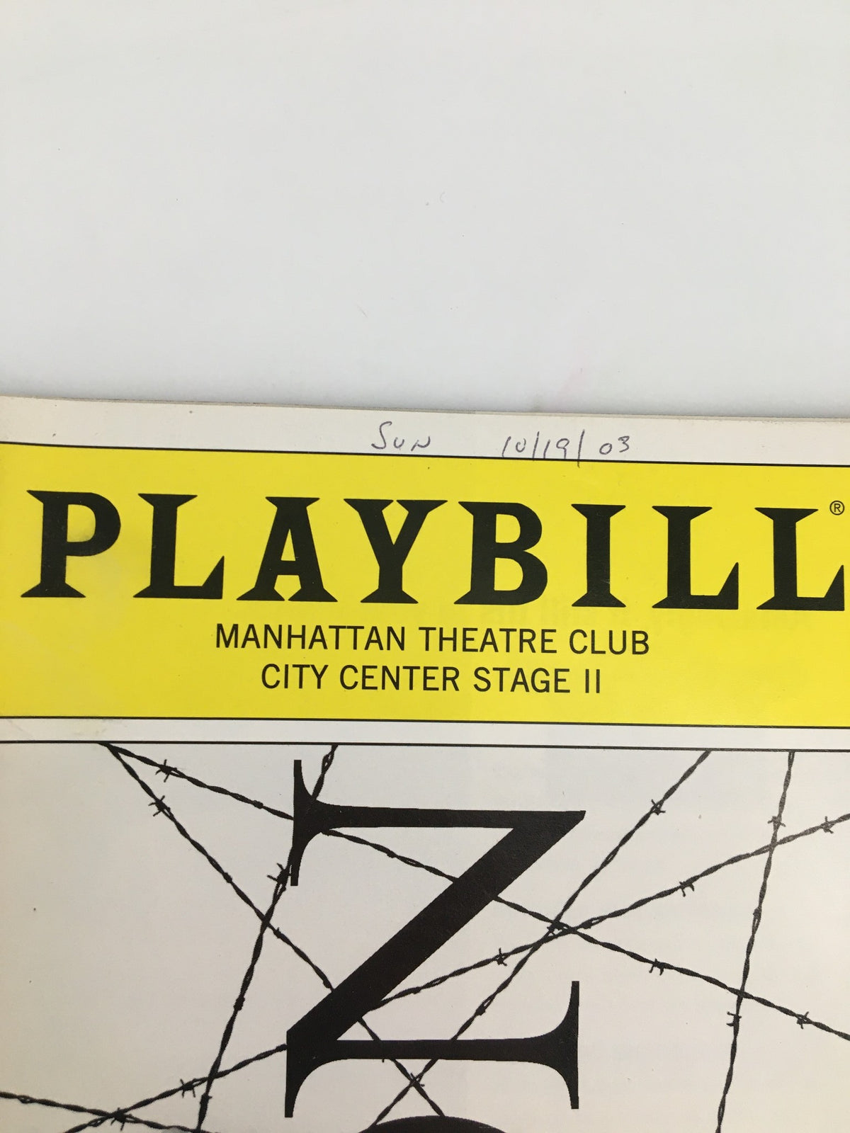 Close-up of the 2003 Manhattan Theatre Club Playbill for 'Iron', highlighting the title and the date of the performance.