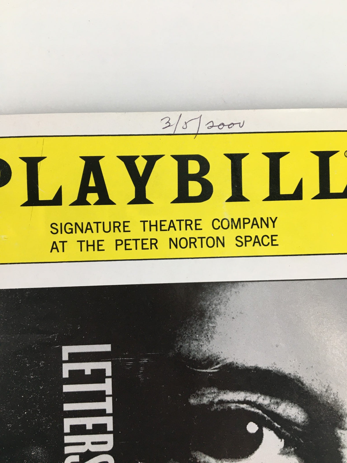 Close-up view of the 2000 Playbill from Signature Theatre Company, featuring Chris De Oni in Letters from Cuba. Highlights the title and the company details.