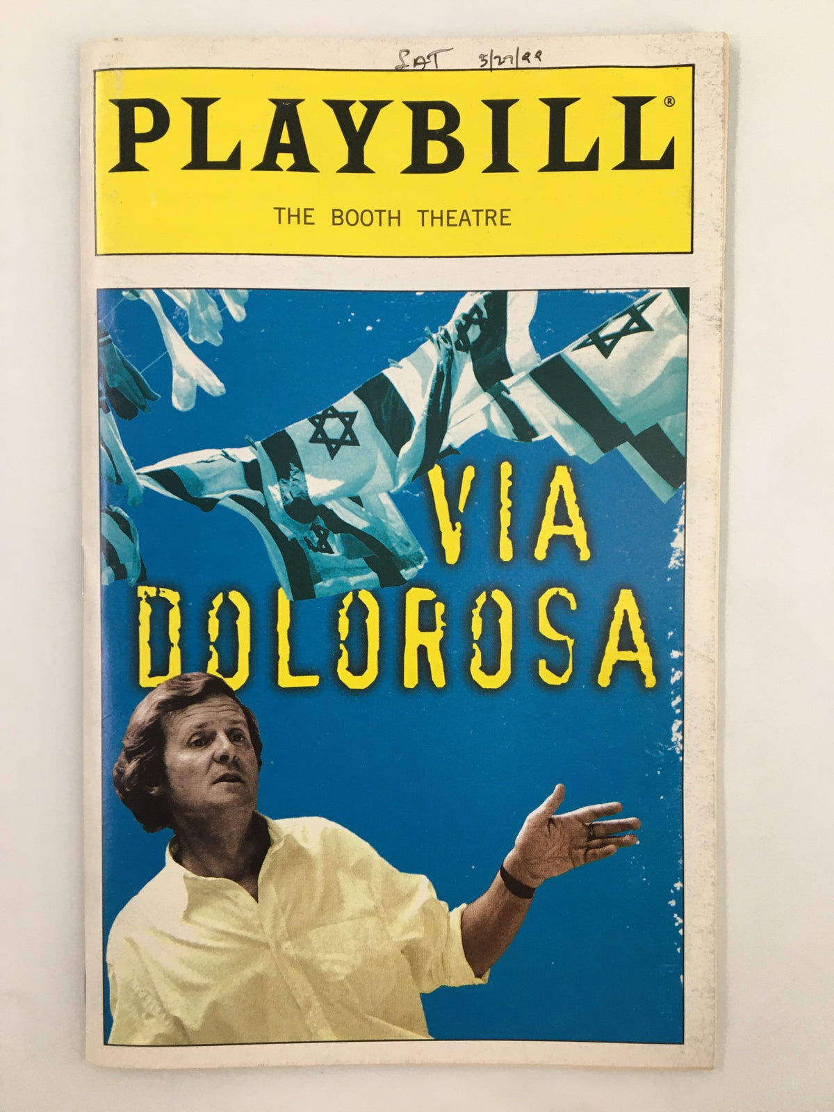 1999 Playbill for Via Dolorosa at the Booth Theatre featuring vibrant cover with Israeli flags and a theatrical performer.