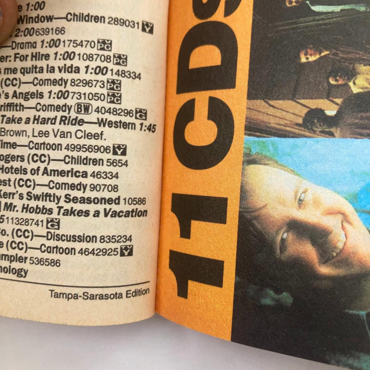 Interior view of TV Guide Magazine August 16 1997 featuring program listings and show times for the Tampa-Sarasota edition. Highlights include various TV shows and movies scheduled for the day, showcasing a unique piece of television history.