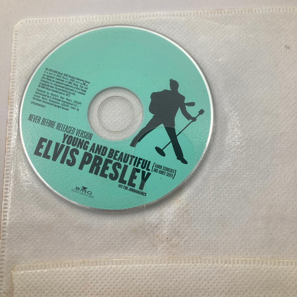 Collectible disc included with TV Guide Magazine August 17 2002, featuring the never-before-released version of 'Young and Beautiful' by Elvis Presley. This item enhances the magazine's historical value.