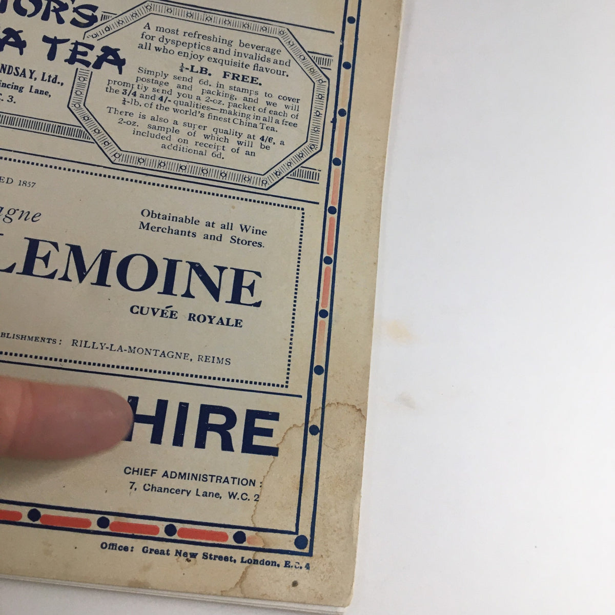 Detail of The Sphere Newspaper, August 6, 1927, focusing on an advertisement including the logo of J. Lemoine and highlighting its availability at various merchants.