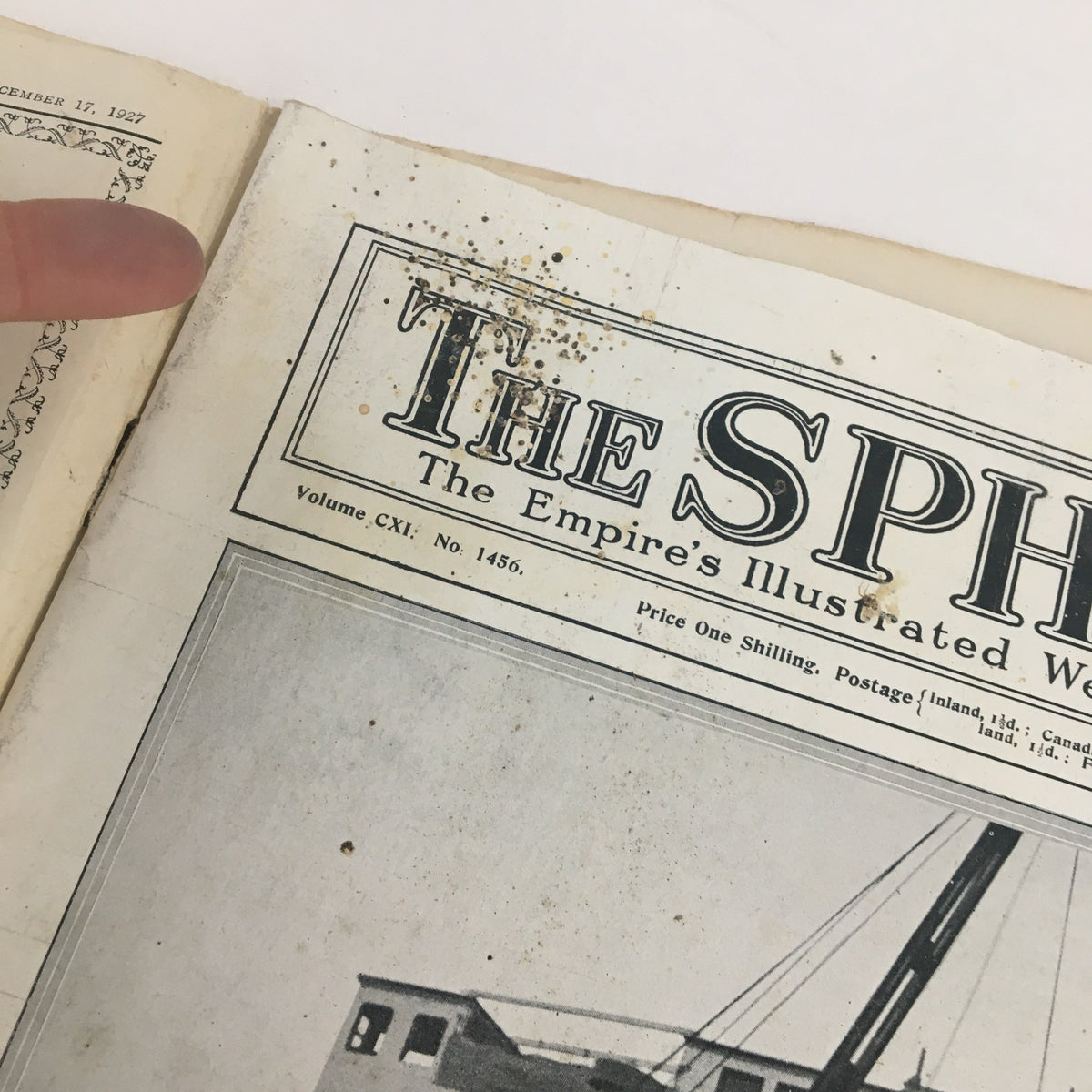 Close-up of The Sphere Newspaper December 27 1927 front cover, highlighting details and condition of the publication.