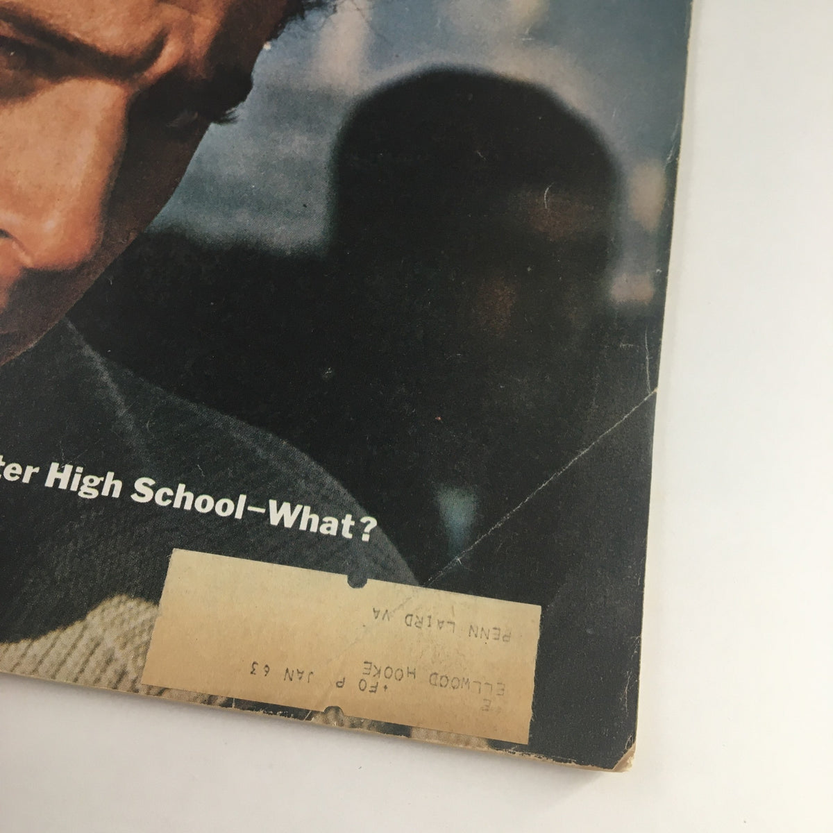 The cover details of The Saturday Evening Post March 10, 1962, with 'We Waste A Million Kids A Year' prominently displayed, and a glimpse of the address label, showcasing the vintage significance of the issue.