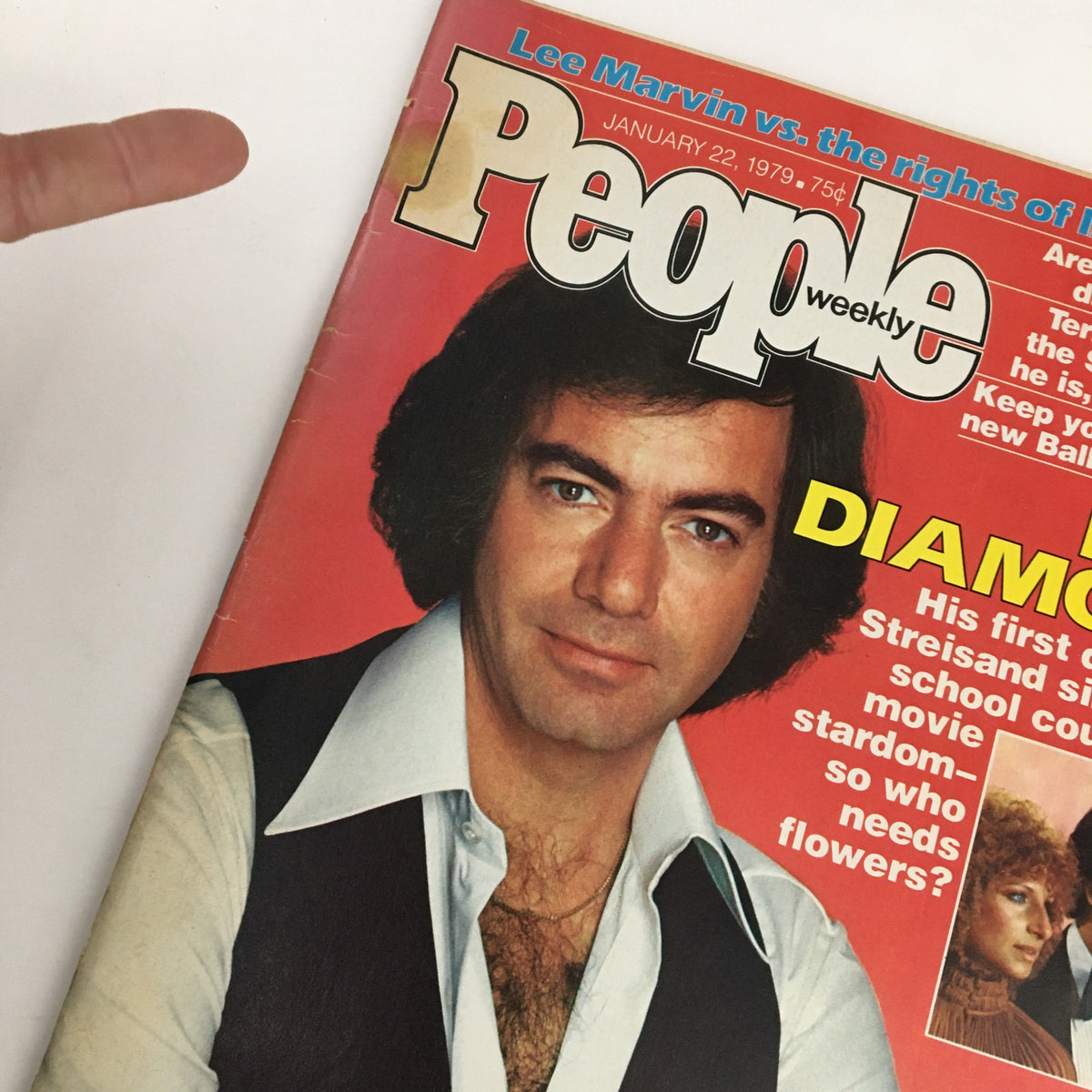 Close-up of the People Weekly Magazine cover from January 22, 1979, emphasizing Neil Diamond. The text discusses his duet with Barbra Streisand and hints at their star-studded connection.