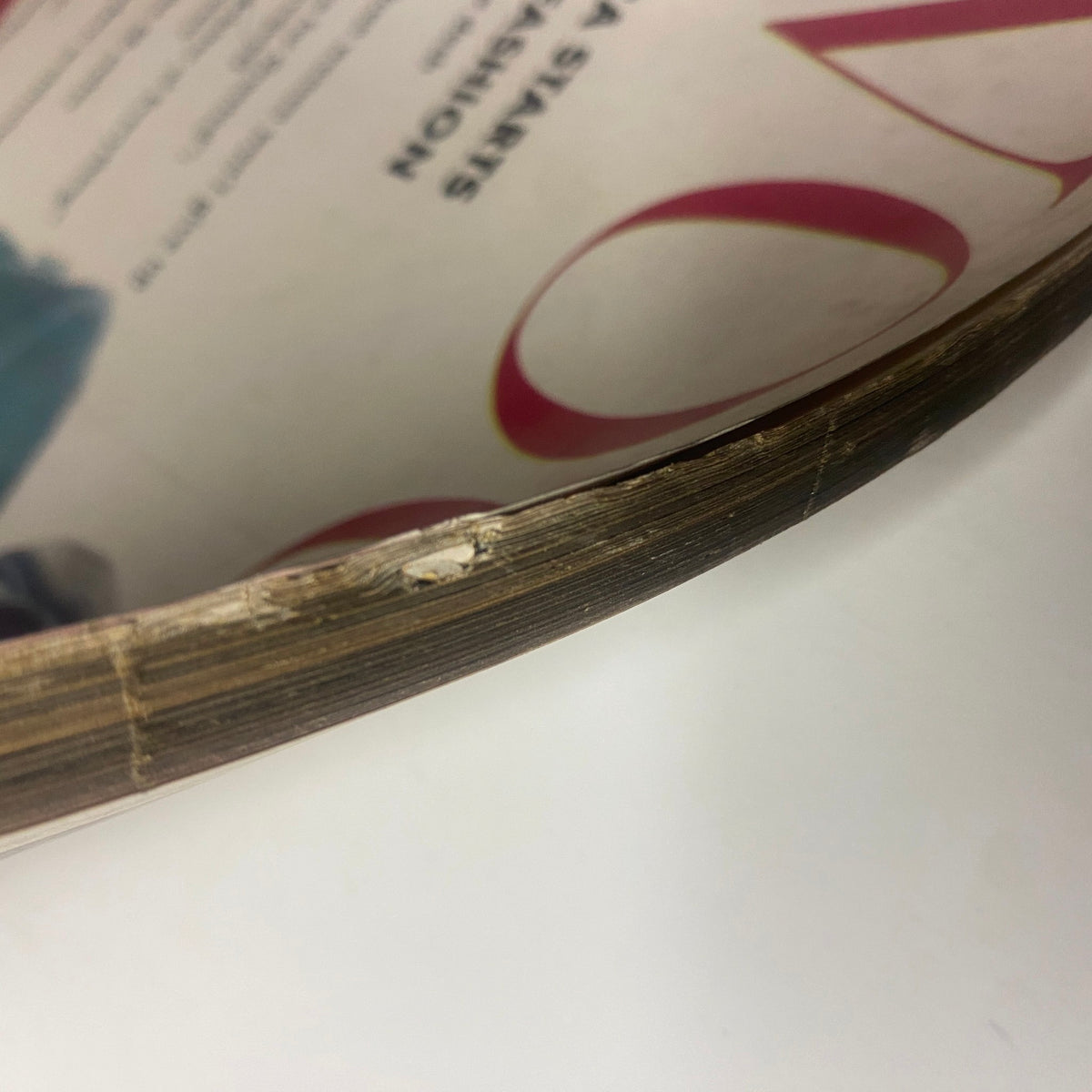 Another close-up showing the spine of Vogue Magazine February 1, 1962, emphasizing its vintage condition and unique characteristics.