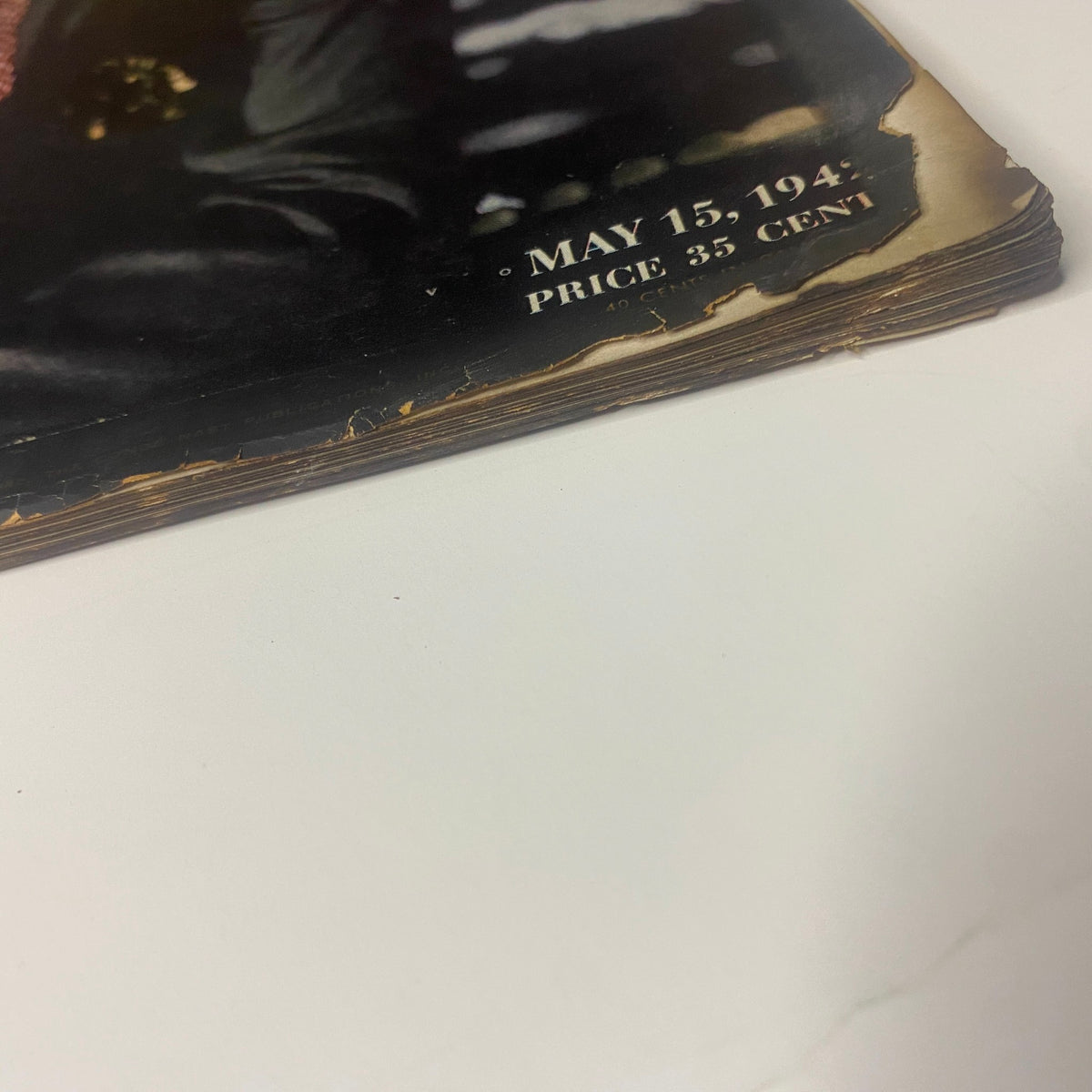 Detail of the spine from Vogue Magazine May 15, 1942, showing wear and aging with a visible price of 35 cents, reflecting the vintage character of the magazine.
