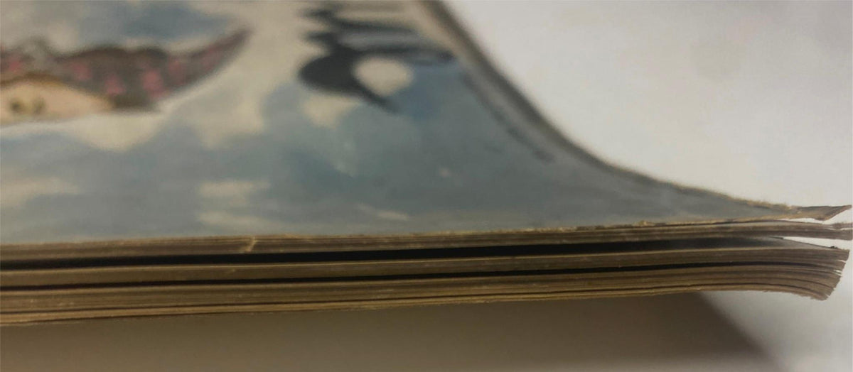 Side view of Vogue Magazine July 15, 1939 Between-Seasons Fashions Cover by Carl Erickson, showcasing the vintage binding and aged paper edges.