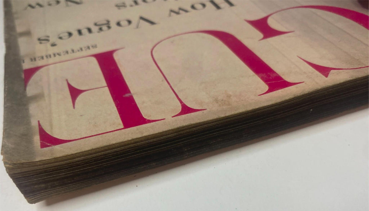 Close-up view of the vintage Vogue Magazine September 1, 1955 Renée Breton Cover by Henry Clarke, showing distinct aged pages and wear.