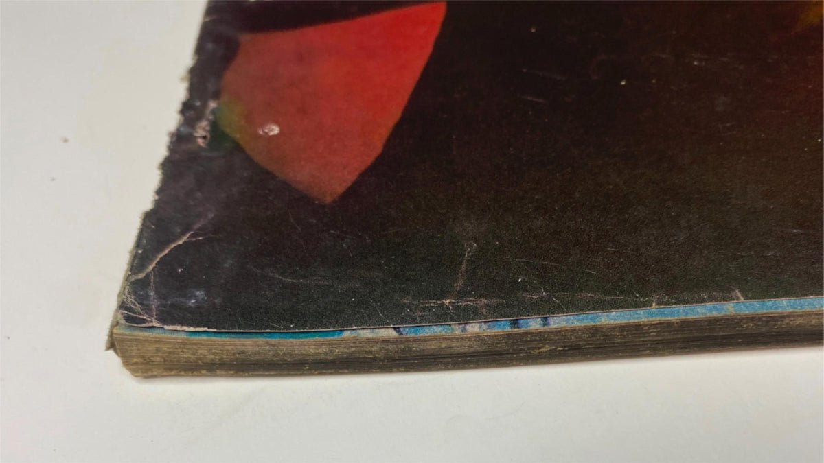 Close-up of the spine of Vogue Magazine November 15, 1961, showing minor wear and vintage charm, emphasizing the magazine's age and history.