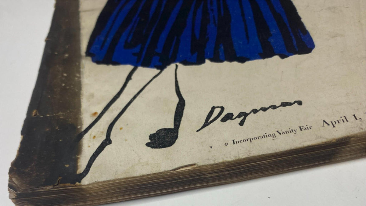 Close-up of the vintage Vogue Magazine April 1, 1947, featuring a colorful illustration and the signature 'Dagmar' amidst vintage wear, highlighting the artistic design elements of the issue.