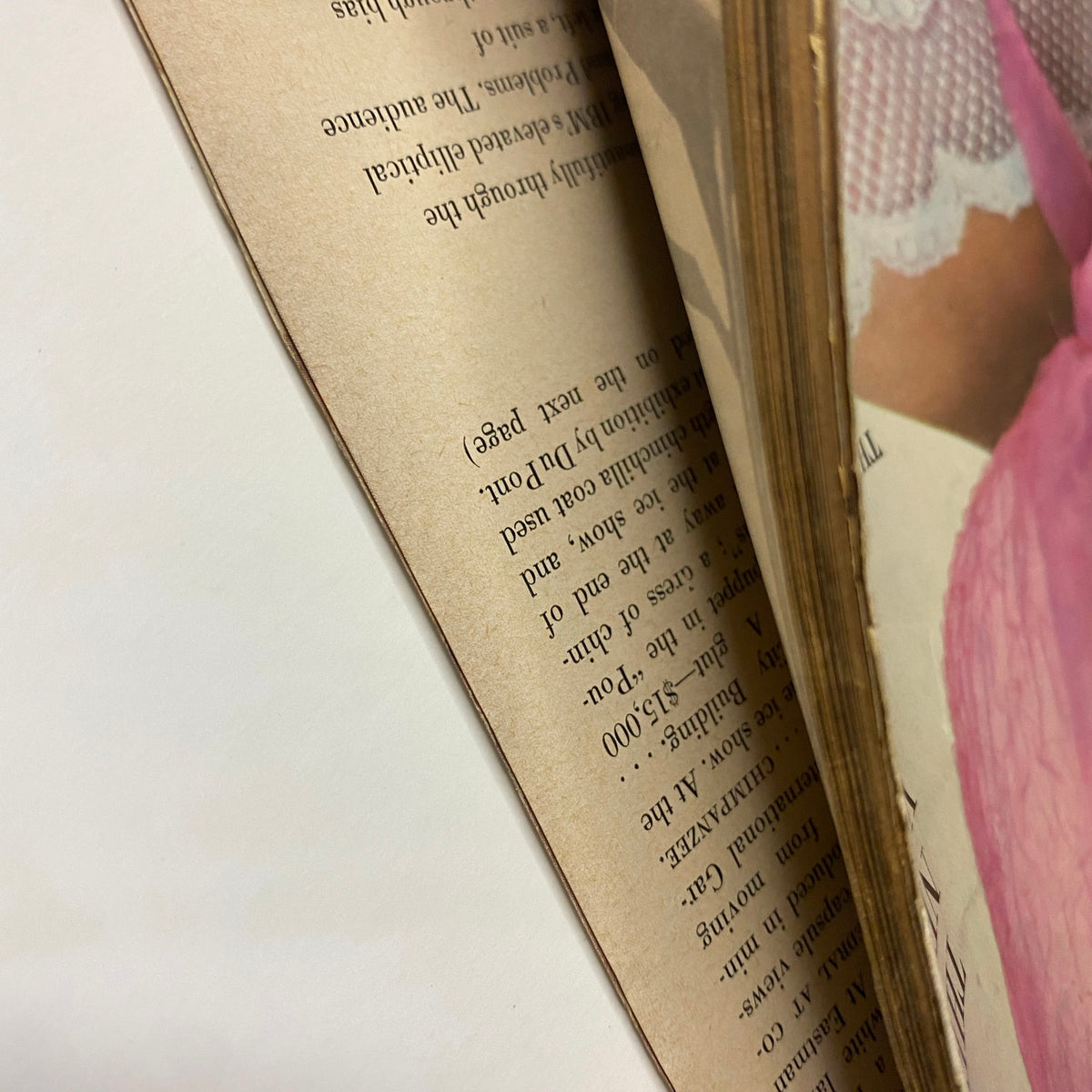 Detailed view of the spine of Vogue Magazine January 15, 1964, illustrating page wear and vintage quality, showcasing its place in fashion history.