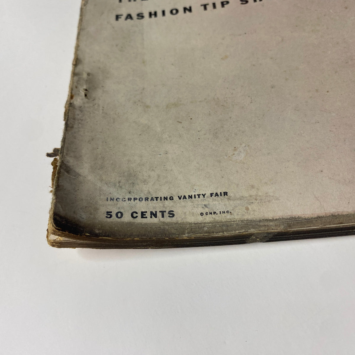 Back cover of Vogue Magazine May 1, 1952 showing magazine details and vintage browsing wear.