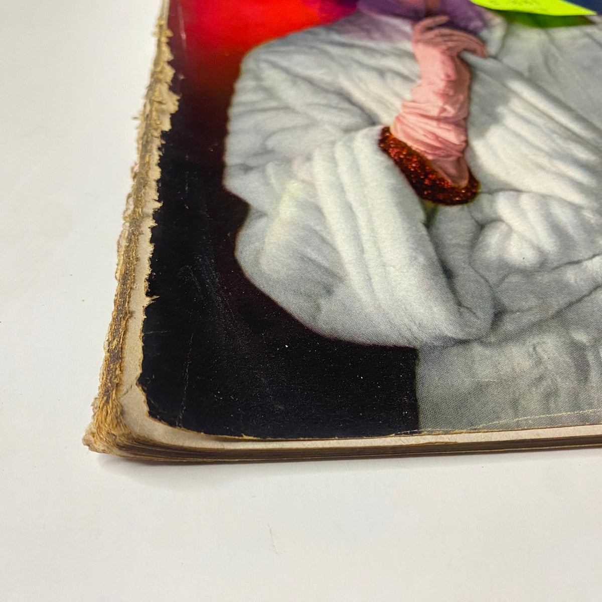 Close-up view of the spine of Vogue Magazine, December 15, 1942, showing wear and vintage character indicative of its age.
