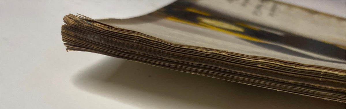 Side view of the spine from Vogue Magazine August 15, 1945, illustrating wear and toning on the pages, reflective of the magazine's vintage status.