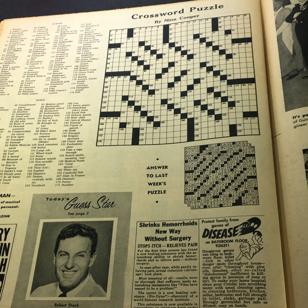 Crossword puzzle page in VTG New York News Coloroto Magazine January 31 1960, featuring a crossword grid by Nina Cooper and an advertisement for Robert Stack.