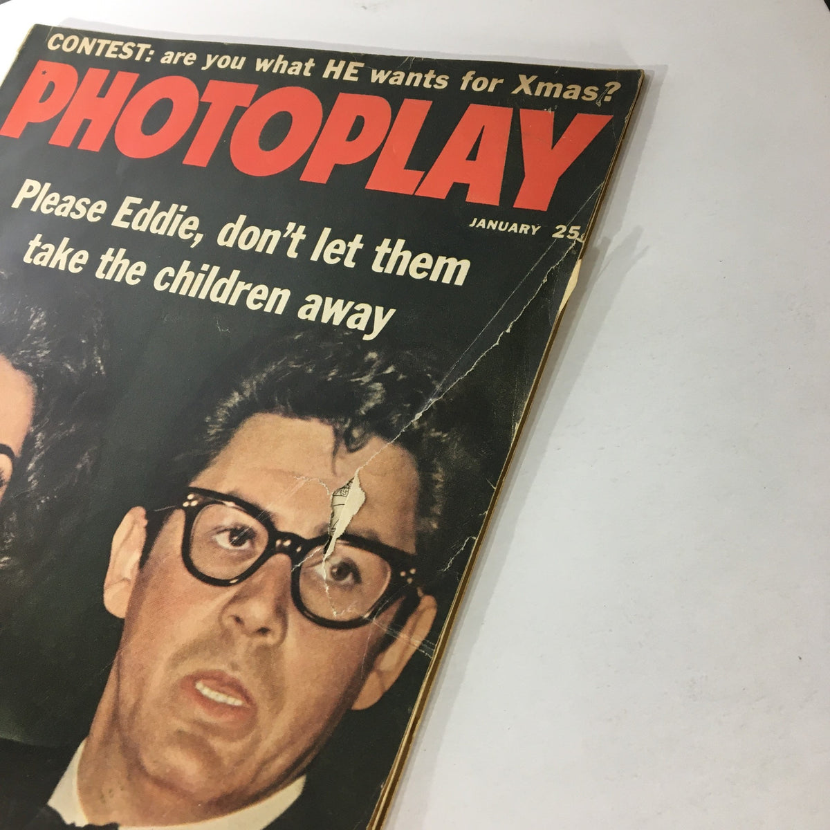 Close-up view of the cover of VTG Photoplay Magazine January 1961 displaying Elizabeth Taylor and Eddie Fisher.