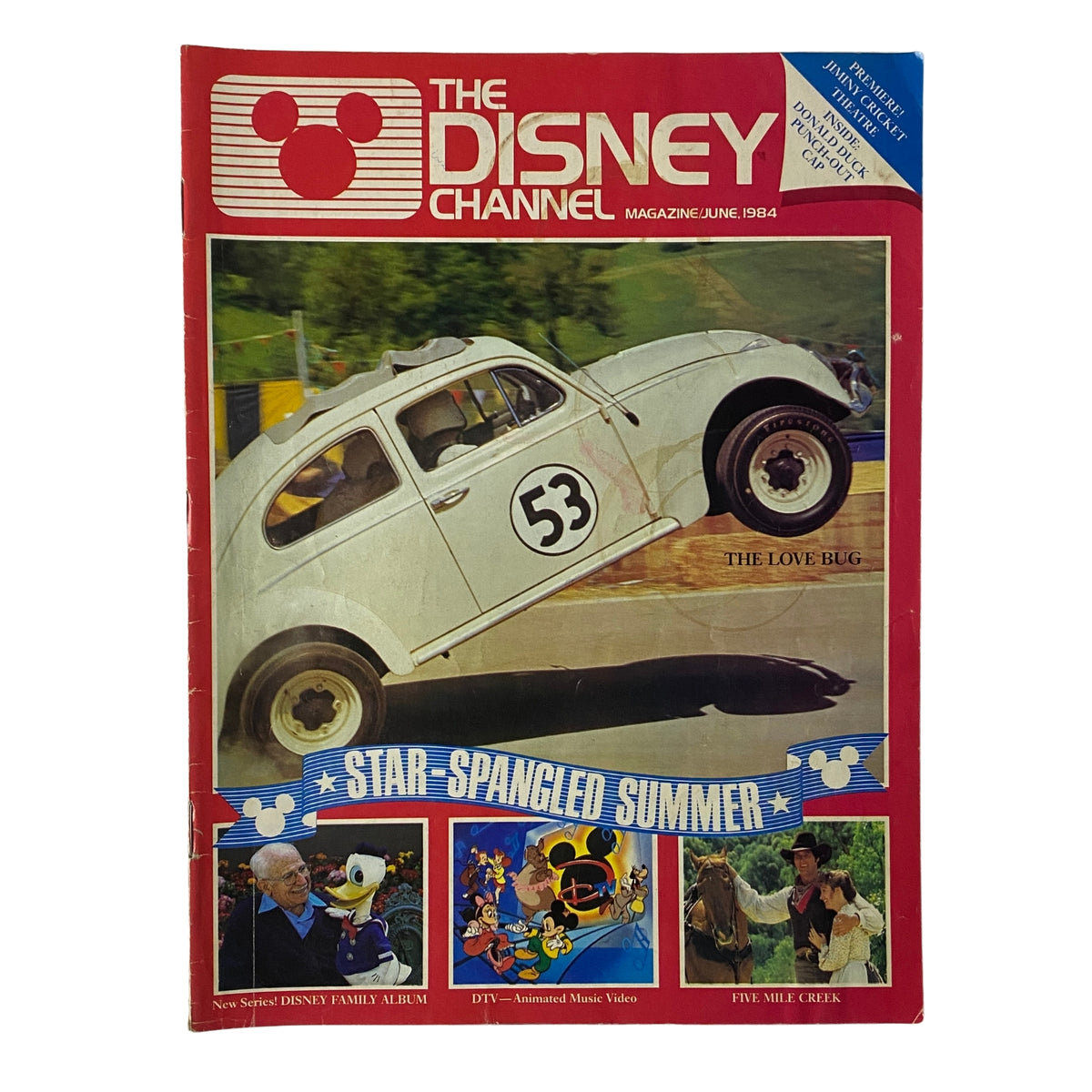 The Disney Channel Magazine from June 1984 featuring The Love Bug on the cover, showcasing a Volkswagen racing with the number 53, and highlighting summer programming.