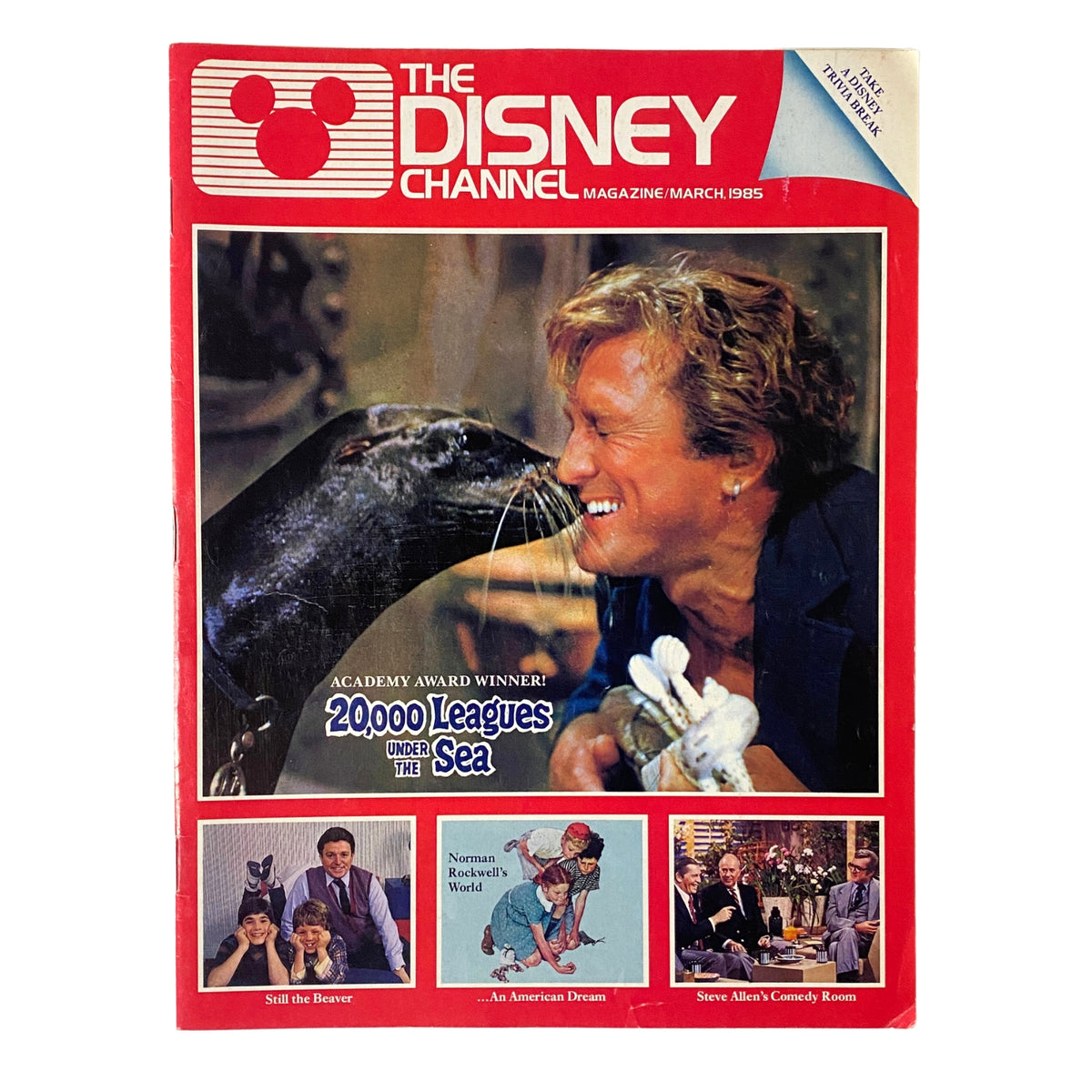 The Disney Channel Magazine March 1985 featuring 20,000 Leagues Under the Sea on the cover, showcasing a smiling pet seal with a human, original magazine in very good condition.