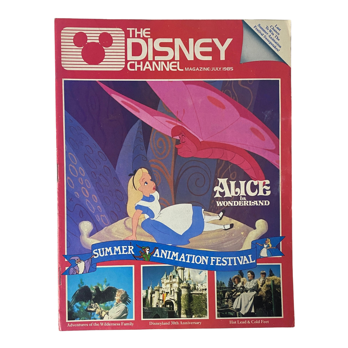 Cover of The Disney Channel Magazine July 1985 featuring Alice in Wonderland, with artwork of Alice and a pink butterfly, highlighting the Summer Animation Festival and Disneyland's 30th anniversary.
