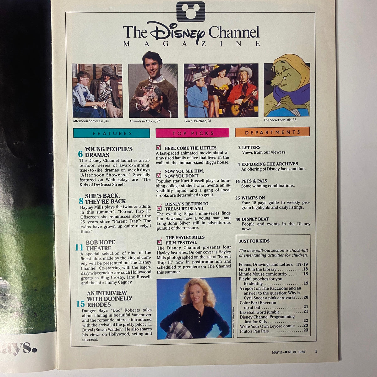 Inside page of The Disney Channel Magazine - May 11, 1986, detailing features and departments, including highlights about Hayley Mills and various children's programming.