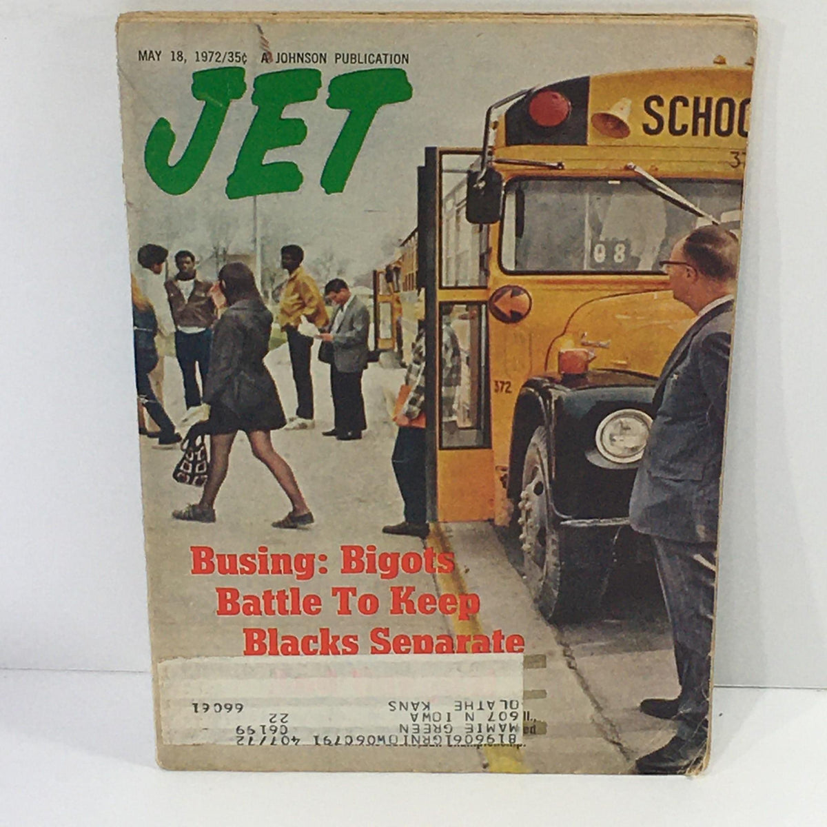 Cover of Jet Magazine dated May 18, 1972, featuring the headline 'Busing: Bigots Battle To Keep Blacks Separate', showcasing a historical scene with a school bus and individuals discussing busing issues amidst the backdrop of the civil rights movement.