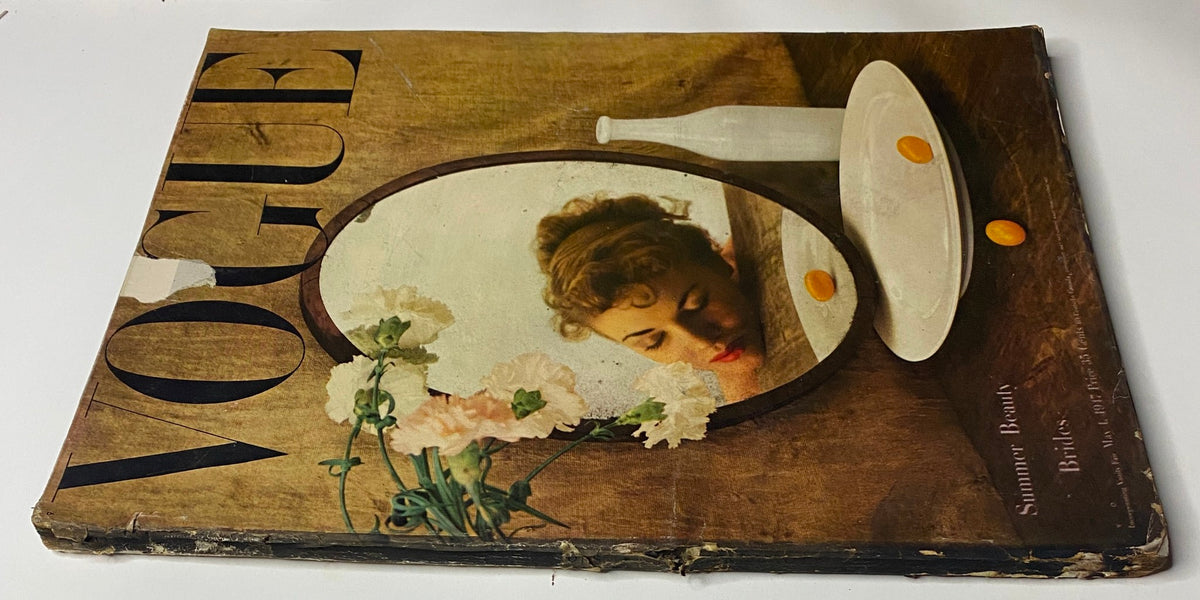 Another view of Vogue Magazine May 1, 1947 showcasing Summer Beauty Brides by Irving Penn, highlighting the cover design with a mirror and flowers.